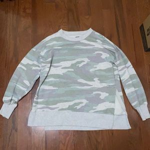 A light gray, green, and purple camo-sweatshirt.